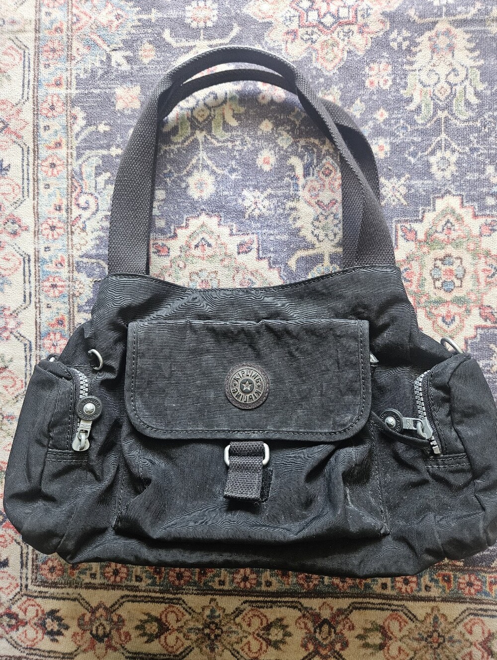 Black nylon Kipling Felix Large handbag with a zippered closure.